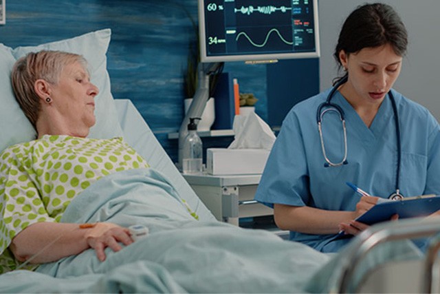 Healthcare professional with patient, utilizing Medical Mounts