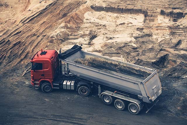 Heavy-duty truck at construction site, perfect for Truck Mount and Heavy Duty Mount installation